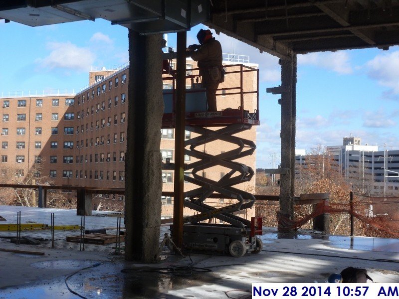 Continued welding clips at the 3rd floor East Elevation